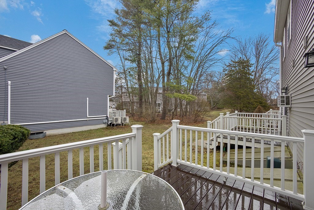 78 Key Street, Unit 78 Millis, MA 02054 - Photo 26 of 33 a view of a white house with two chairs and a table
