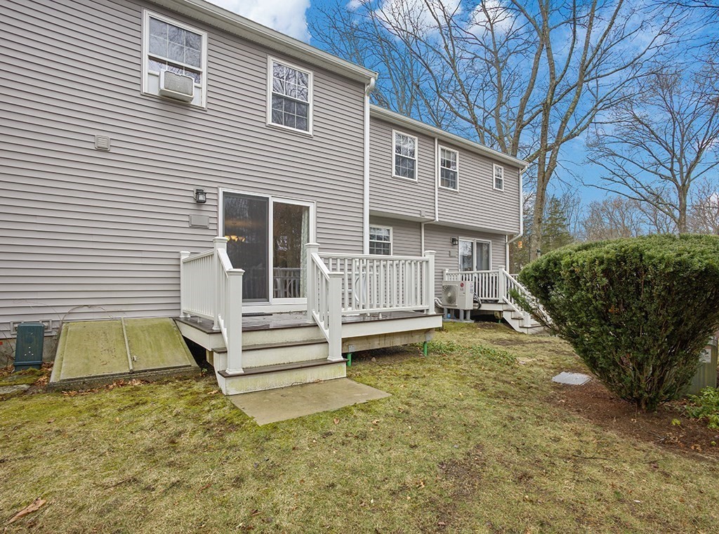 78 Key Street, Unit 78 Millis, MA 02054 - Photo 28 of 33 a view of a house with a yard and garage