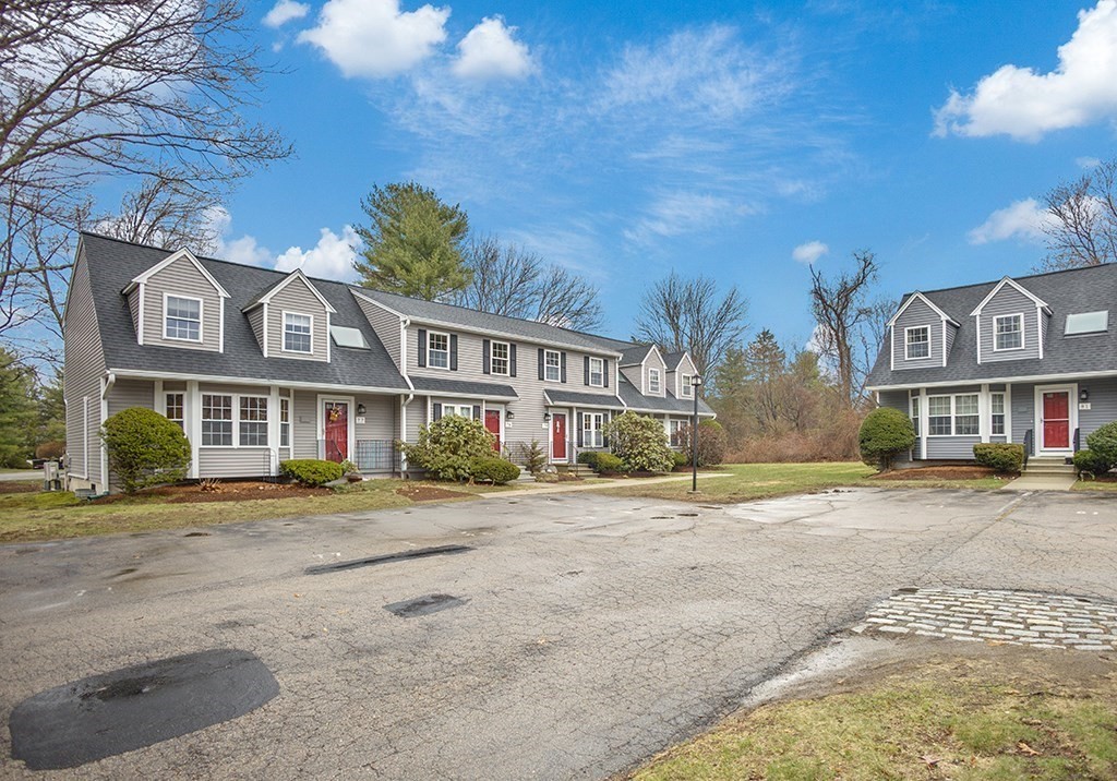 78 Key Street, Unit 78 Millis, MA 02054 - Photo 4 of 33 a front view of residential houses with yard