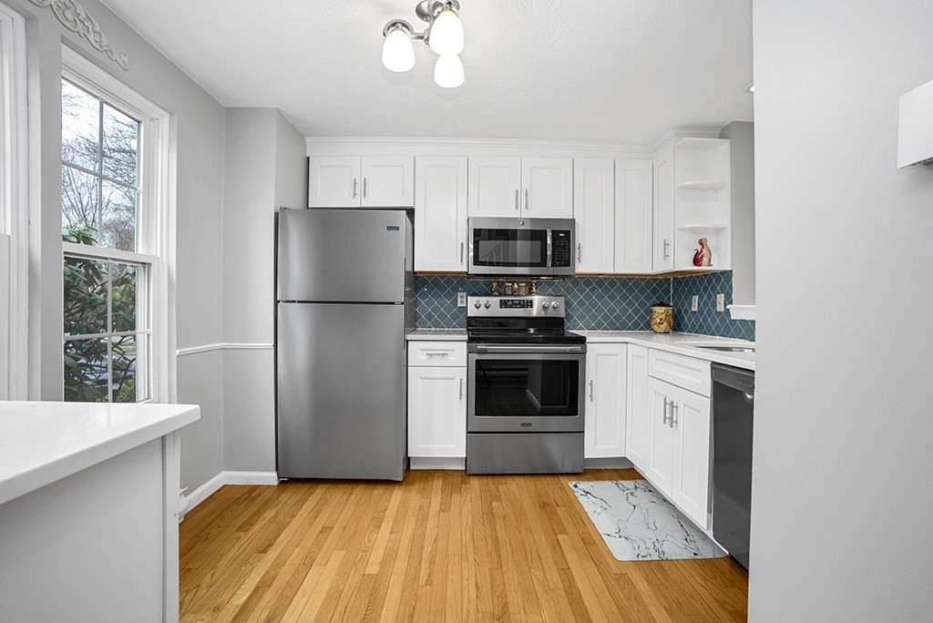 78 Key Street, Unit 78 Millis, MA 02054 - Photo 5 of 33 a kitchen with a refrigerator stove and microwave