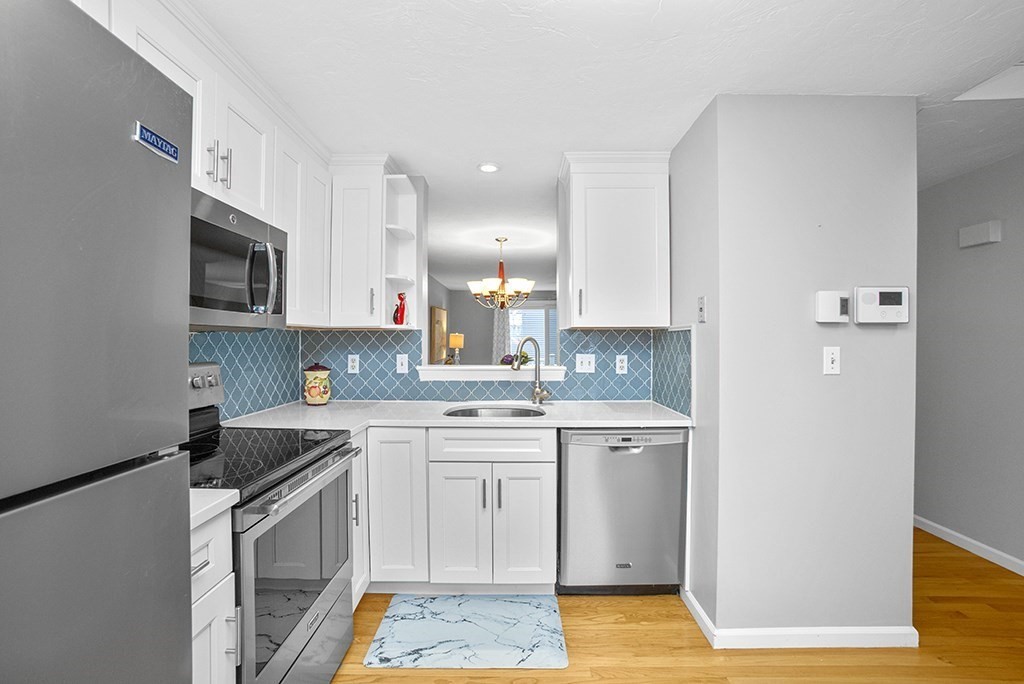 78 Key Street, Unit 78 Millis, MA 02054 - Photo 7 of 33 a kitchen with a sink stove and microwave