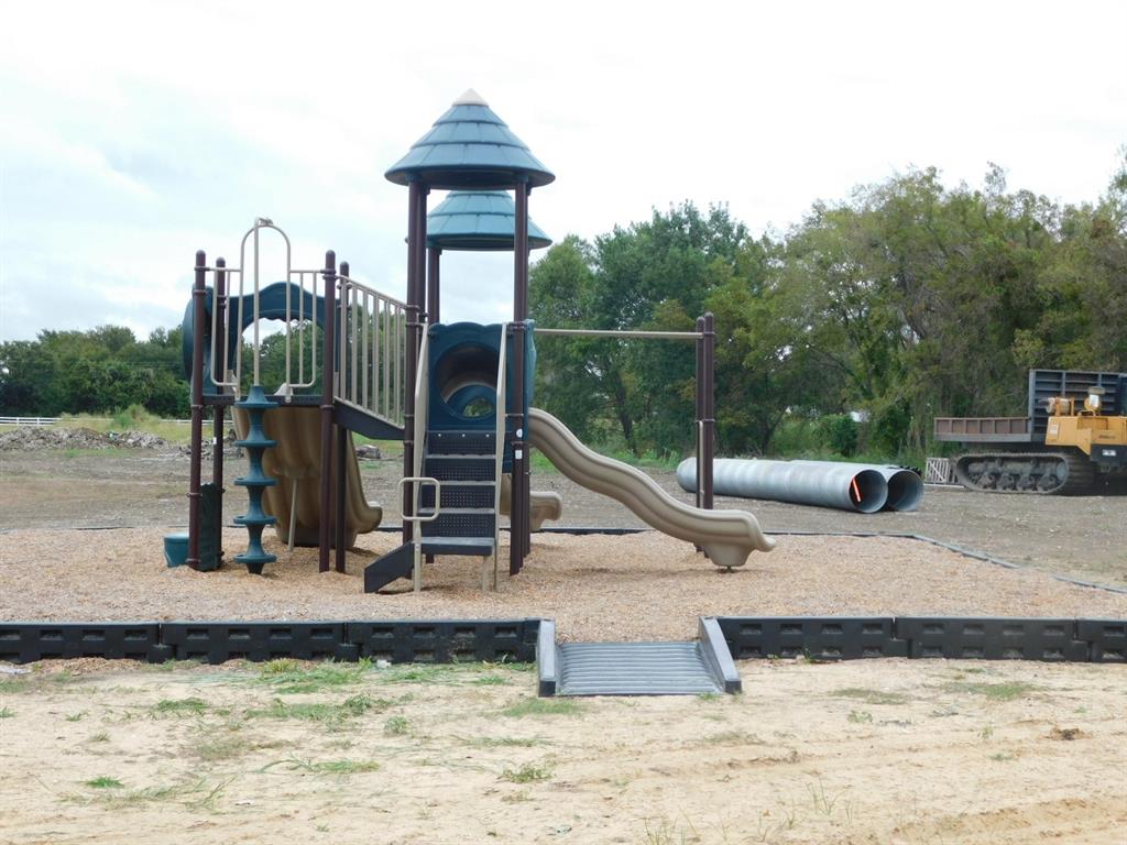 Lot 165 Peninsula Road Kerens, TX 75144 - Photo 25 of 27 a view of a park with swings