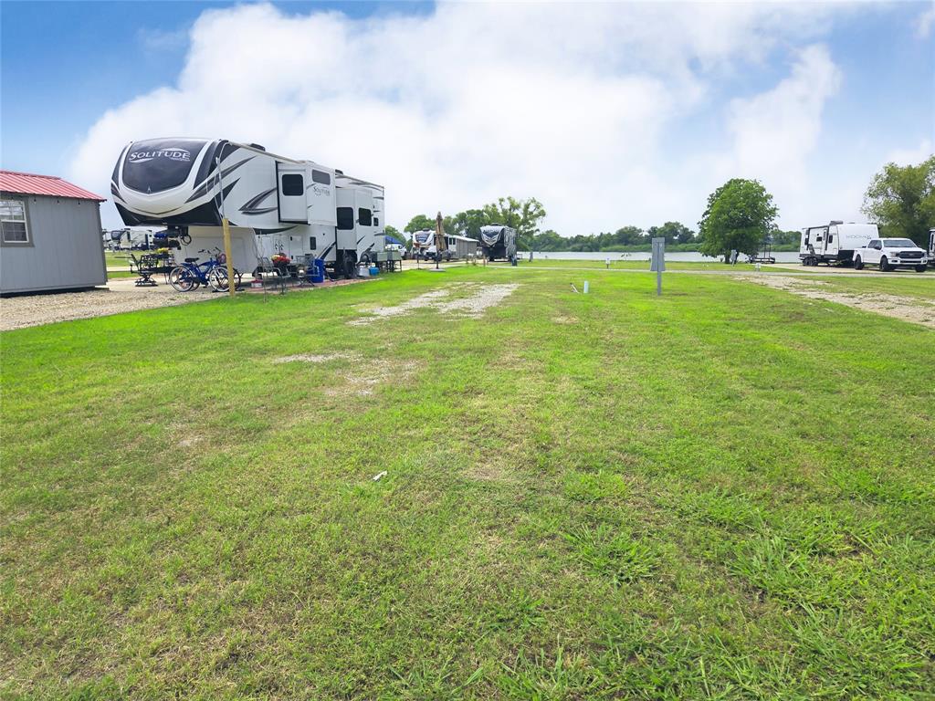 Lot 165 Peninsula Road Kerens, TX 75144 - Photo 8 of 27 a view of a big yard with sitting area