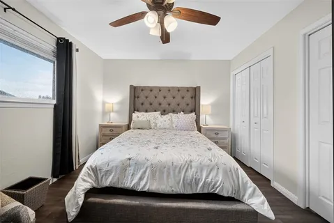 a bedroom with a bed and window