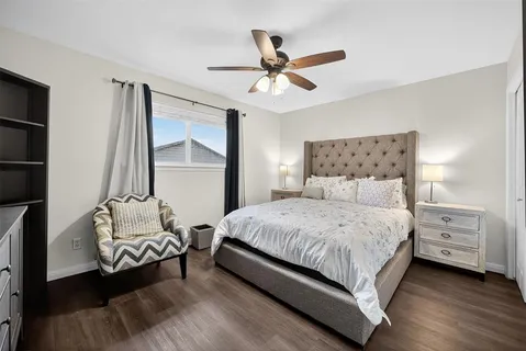 a bedroom with a bed and window