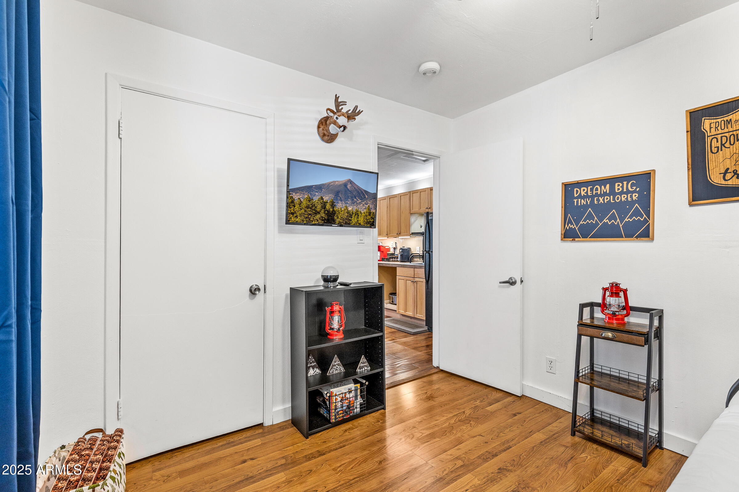 1159 Coyote Road Munds Park, AZ 86017 - Photo 18 of 22 a view of room with toys and wooden floor