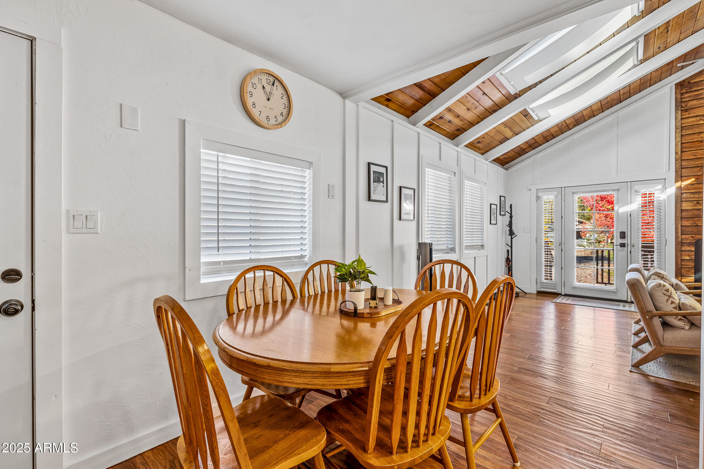 1159 Coyote Road Munds Park, AZ 86017 - Photo 9 of 22 a dining room with furniture and wooden floor