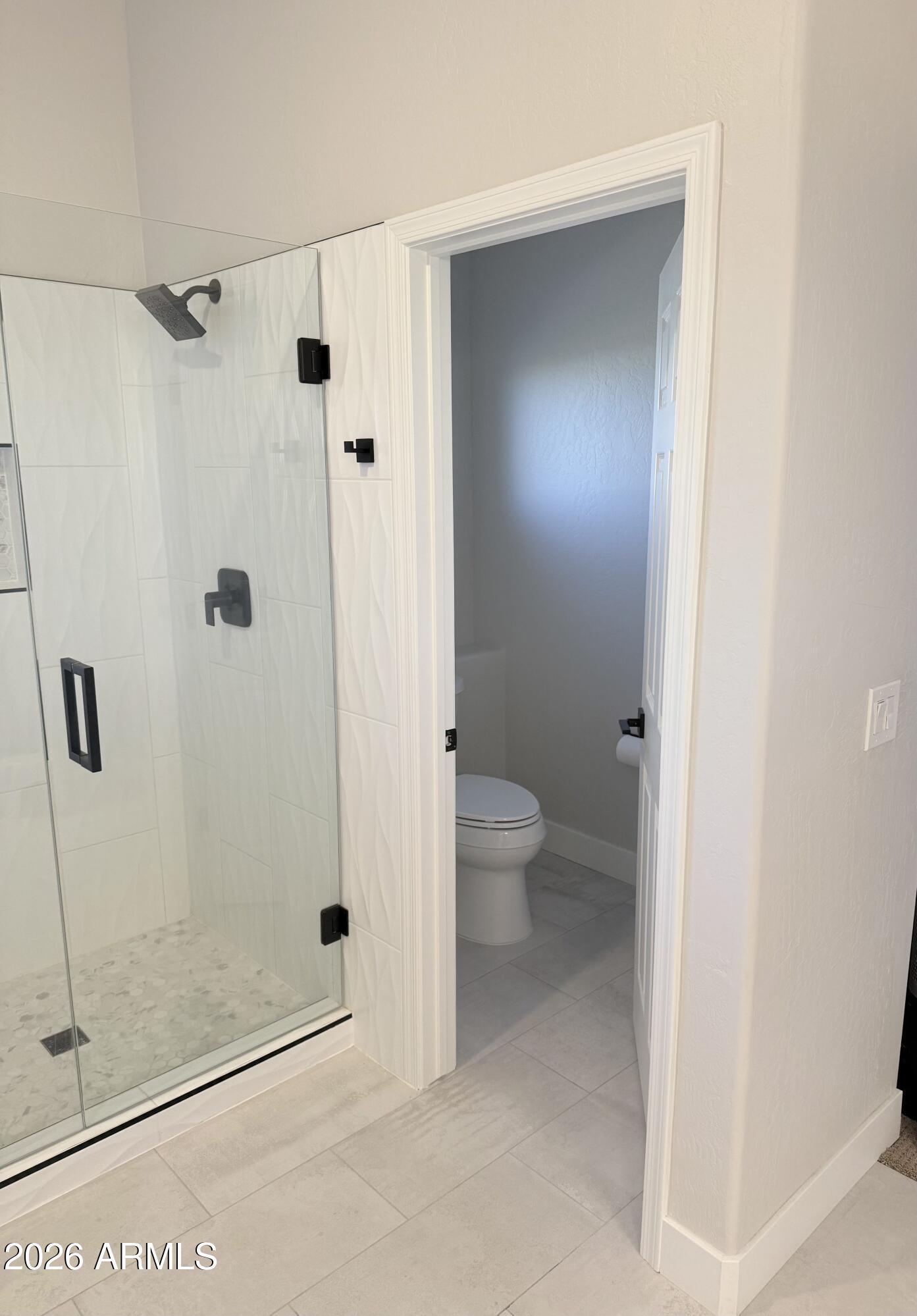 3426 East Clark Road Phoenix, AZ 85050 - Photo 25 of 48 a bathroom with a glass door shower
