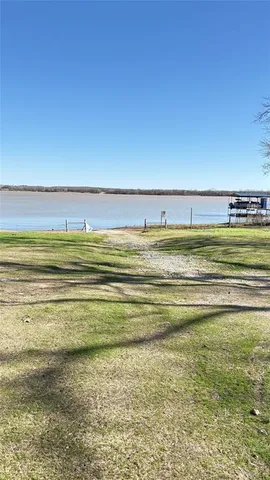 a view of a large body of water with a building in the background