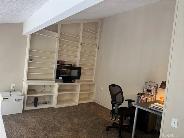 a view of a workspace with furniture