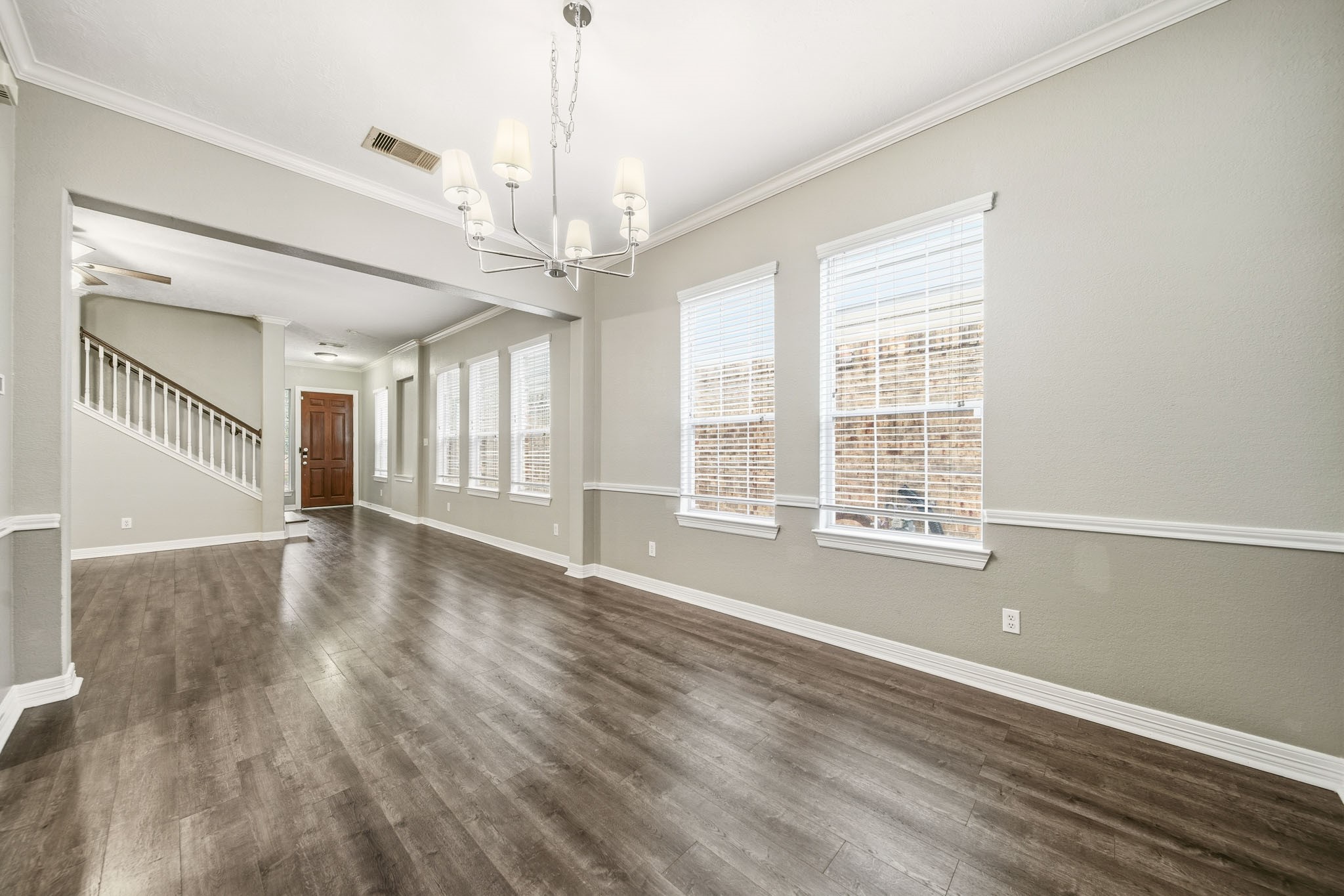 2711 Wallingford Pines Houston, TX 77042 - Photo 3 of 8 a view of an empty room with wooden floor and a window