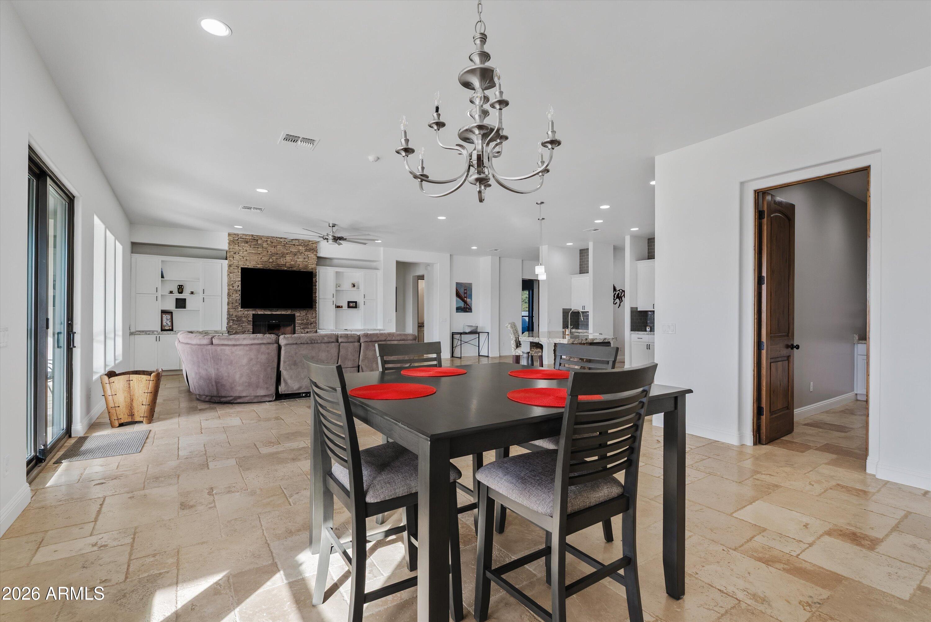 1617 West Maddock Road Phoenix, AZ 85086 - Photo 19 of 50 a view of a dining room with furniture and a chandelier