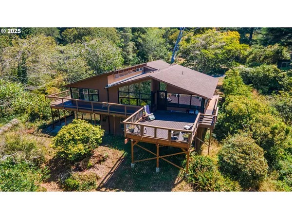 a terrace with outdoor seating and trees