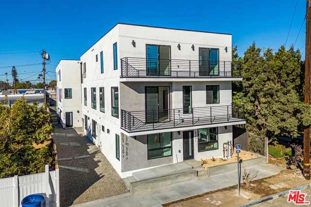 a kitchen with stainless steel appliances a sink stove and refrigerator