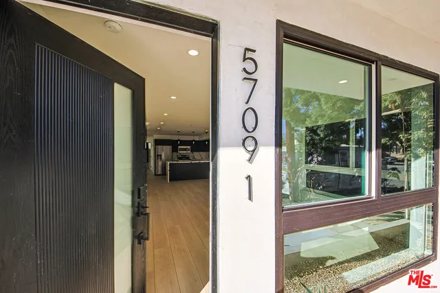 a bathroom with a toilet sink and shower