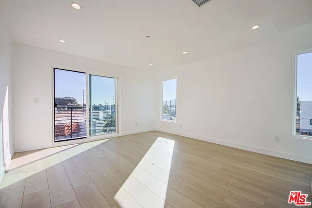 a kitchen with kitchen island a counter top space appliances and cabinets