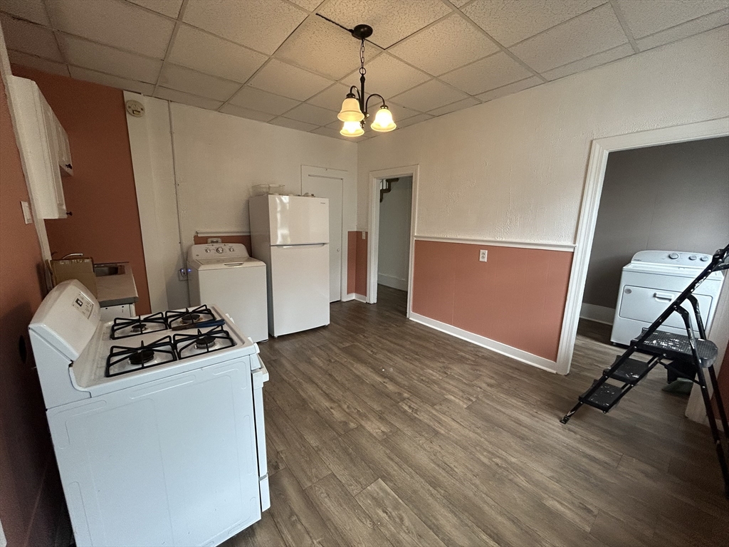 55 P Street, Unit 2 Boston, MA 02127 - Photo 12 of 34 a kitchen with granite countertop a stove and a refrigerator