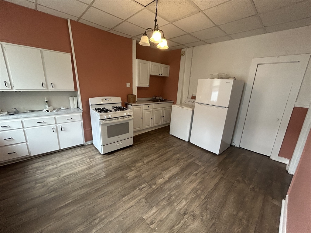 55 P Street, Unit 2 Boston, MA 02127 - Photo 14 of 34 a kitchen with a sink stainless steel appliances and cabinets