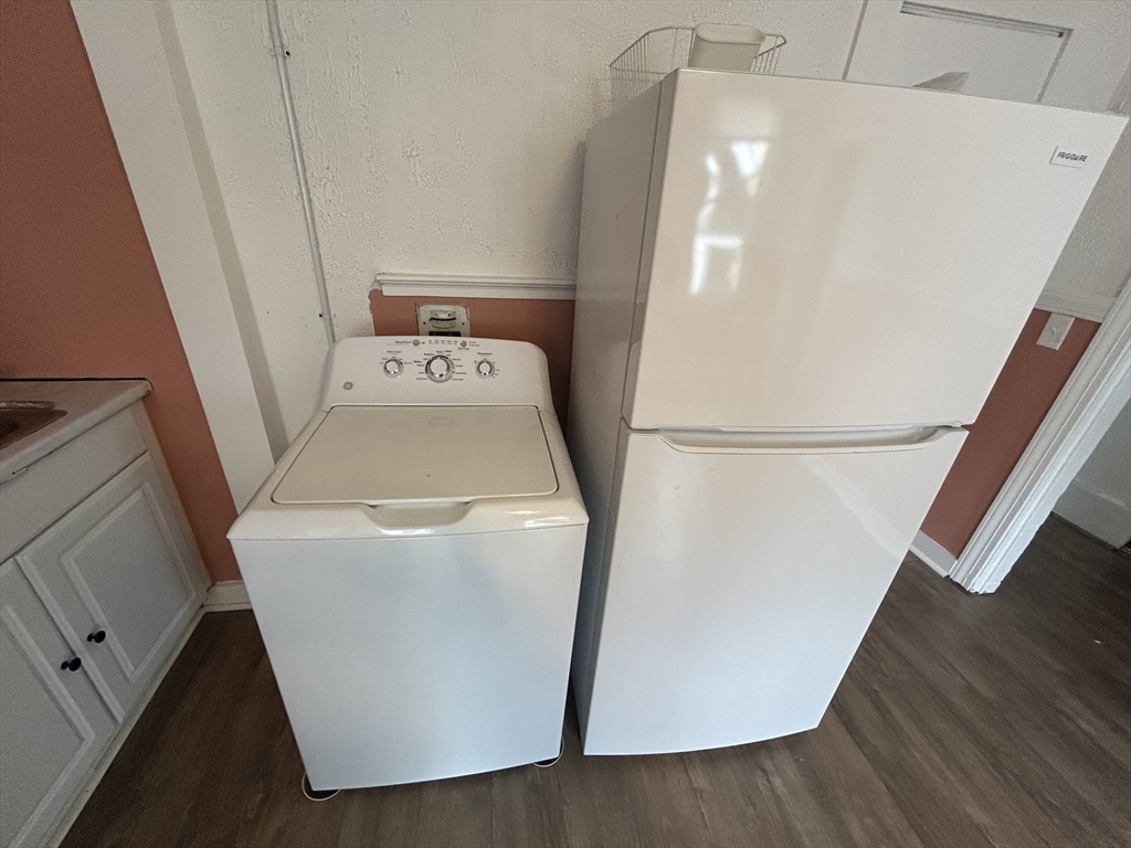 55 P Street, Unit 2 Boston, MA 02127 - Photo 15 of 34 a utility room with wooden floor washer and dryer
