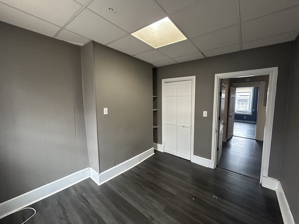 55 P Street, Unit 2 Boston, MA 02127 - Photo 23 of 34 an empty room with wooden floor & windows