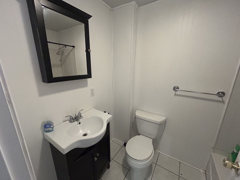 55 P Street, Unit 2 Boston, MA 02127 - Photo 25 of 34 a bathroom with a toilet sink and mirror