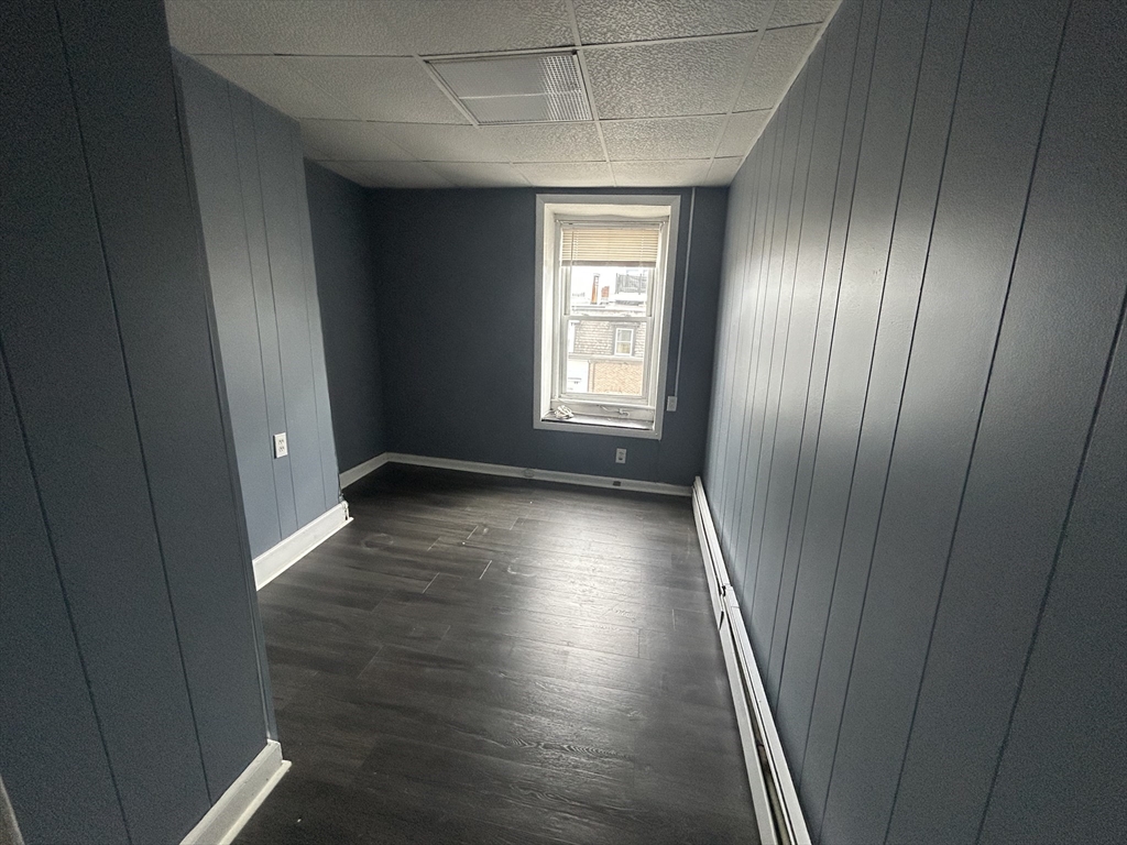 55 P Street, Unit 2 Boston, MA 02127 - Photo 27 of 34 a view of hallway with window and wooden floor