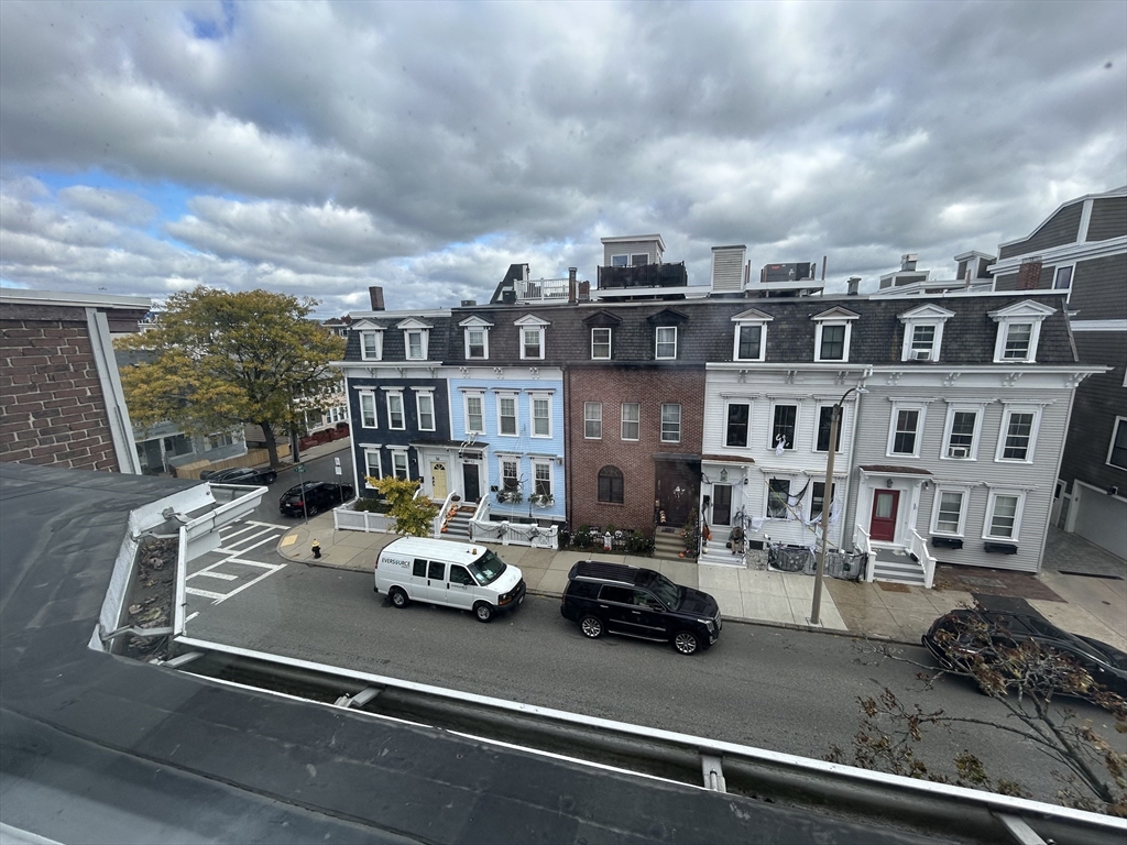 55 P Street, Unit 2 Boston, MA 02127 - Photo 34 of 34 a car parked in front of a building