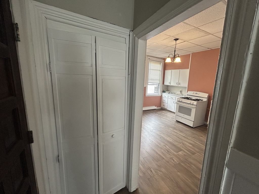 55 P Street, Unit 2 Boston, MA 02127 - Photo 10 of 34 a view of a hallway and a livingroom with furniture