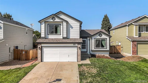 a front view of a house with a garage