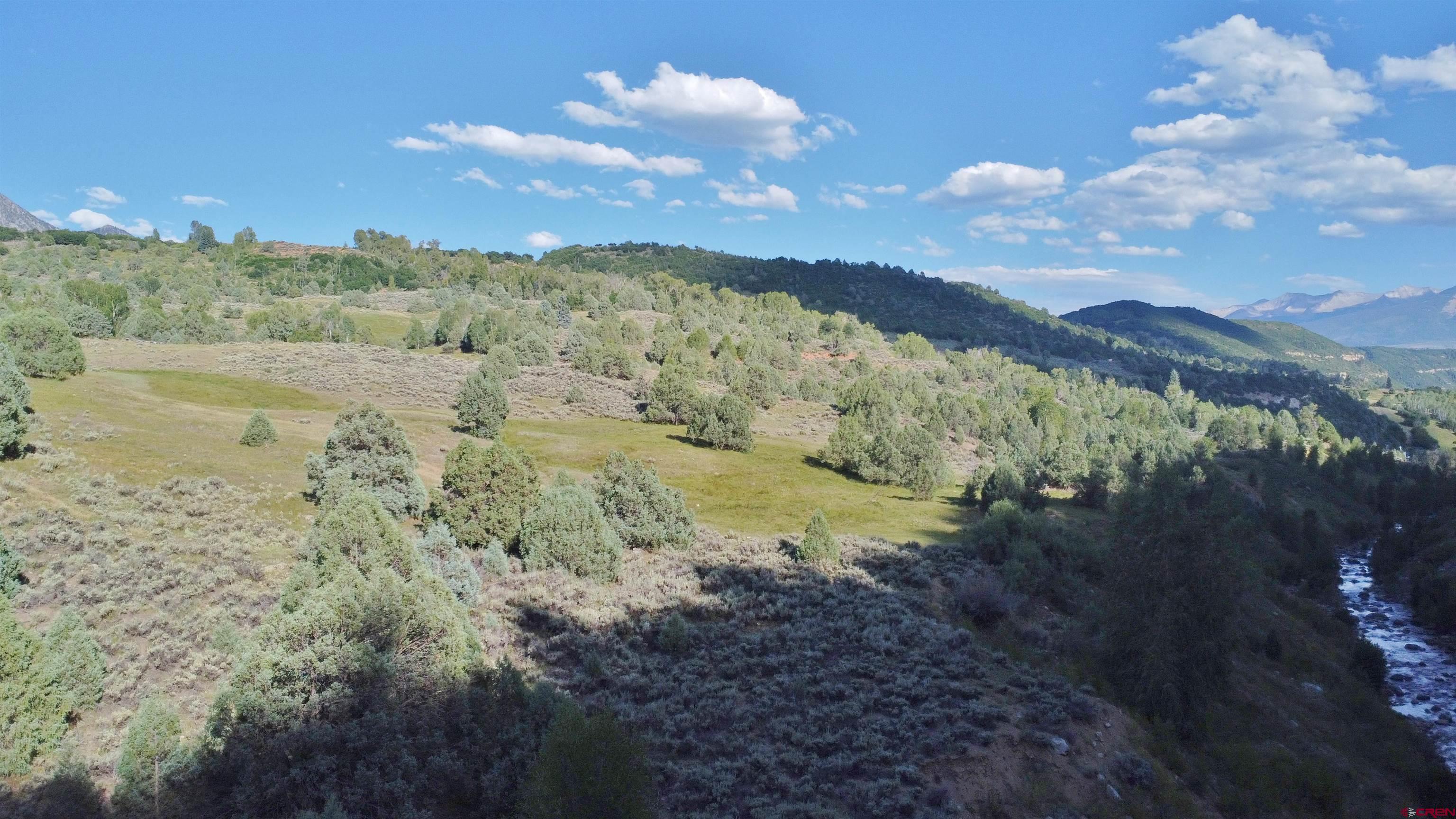2 County Road 77 Somerset, CO 81434 - Photo 2 of 14 a view of a lake with mountains in the background