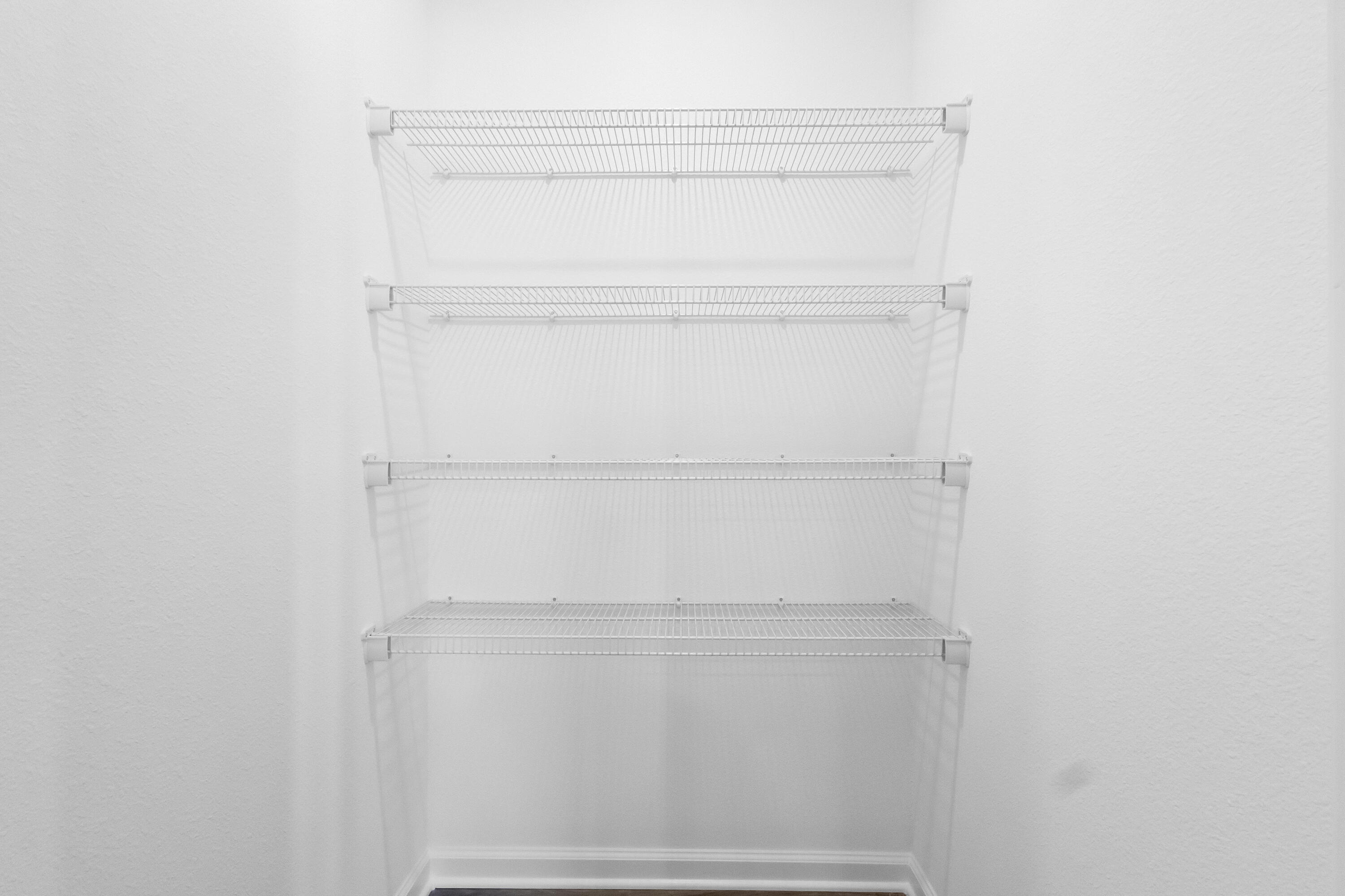 225 Cat Island Road DeFuniak Springs, FL 32433 - Photo 13 of 19 a view of an empty walk in closet