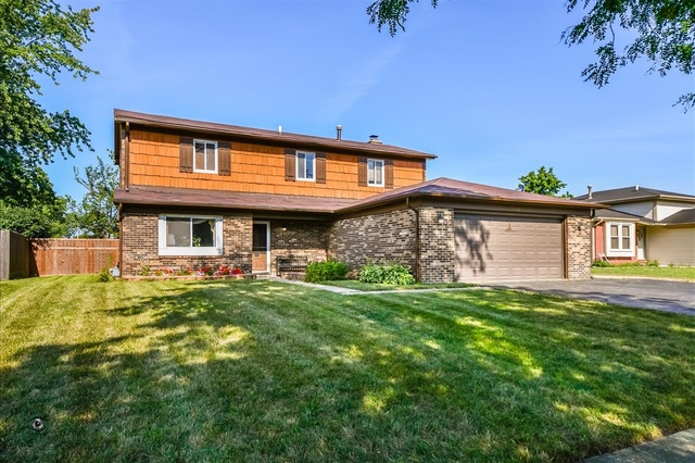 148 Timberlane Road Matteson, IL 60443 - Photo 1 of 23 a front view of a house with garden