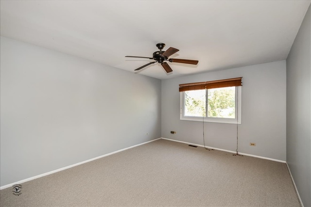 148 Timberlane Road Matteson, IL 60443 - Photo 13 of 23 wooden floor in an empty room with a window