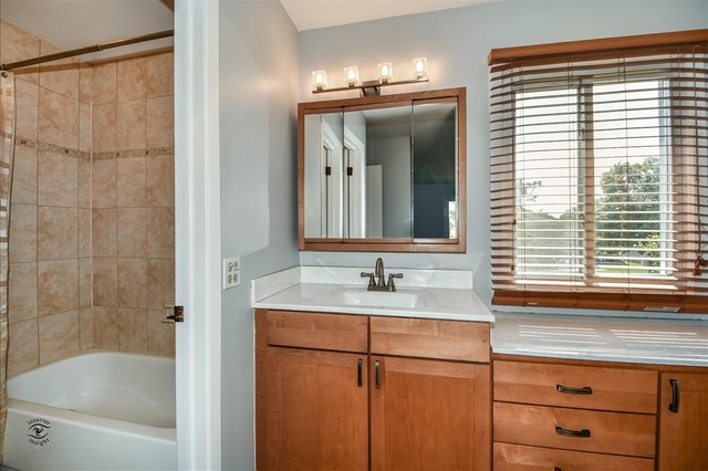 148 Timberlane Road Matteson, IL 60443 - Photo 16 of 23 a bathroom with a sink and a mirror