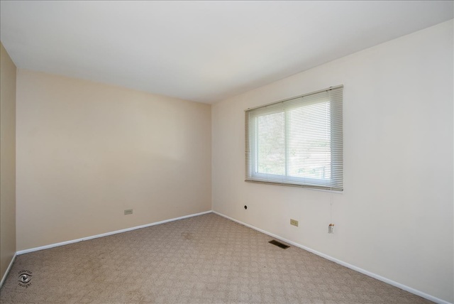 148 Timberlane Road Matteson, IL 60443 - Photo 17 of 23 an empty room with a window