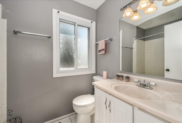 148 Timberlane Road Matteson, IL 60443 - Photo 18 of 23 a bathroom with a granite countertop sink toilet and mirror