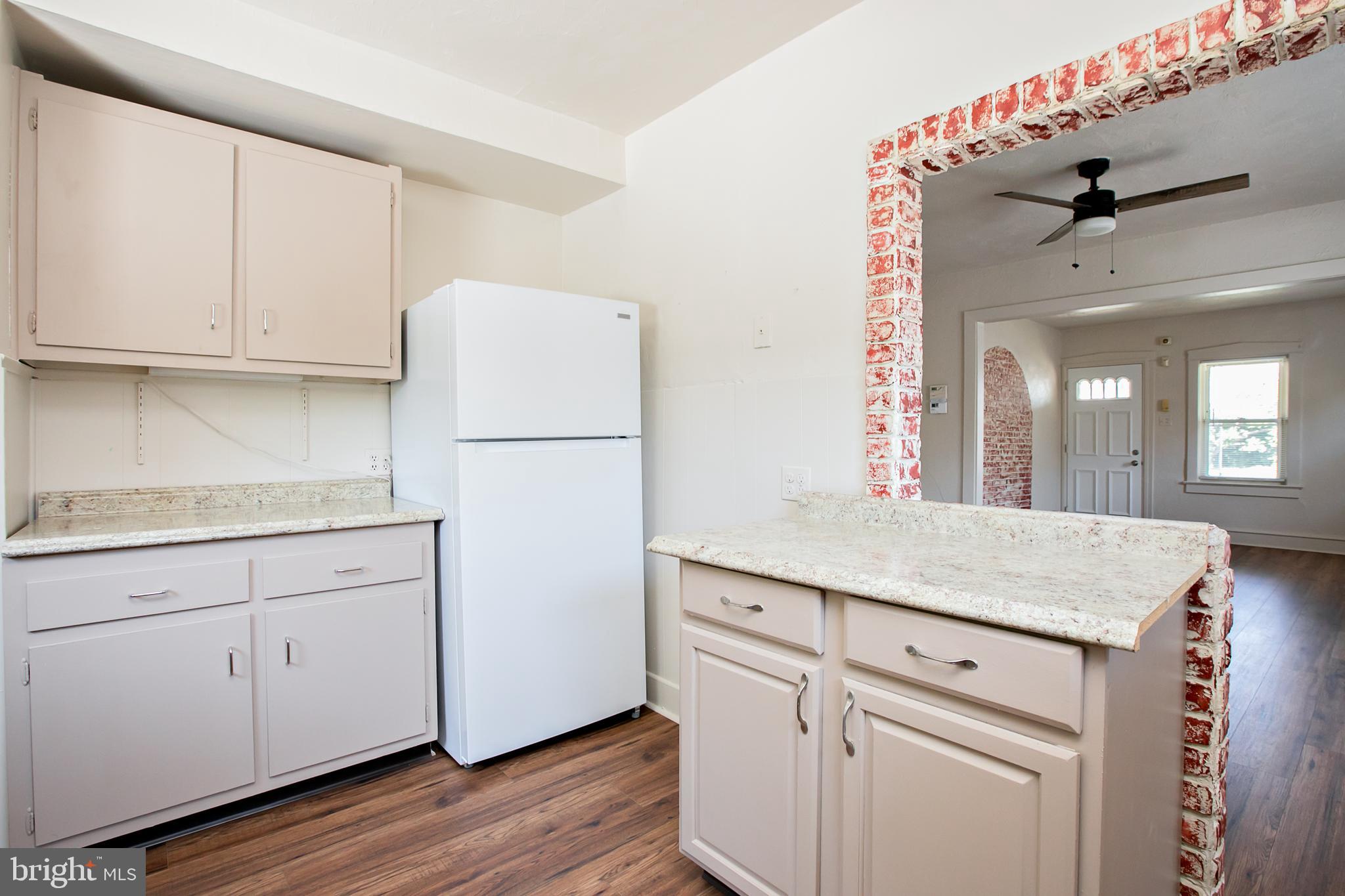 34 Valley Road Mount Ephraim, NJ 08059 - Photo 15 of 39 a kitchen with granite countertop white cabinets and white appliances