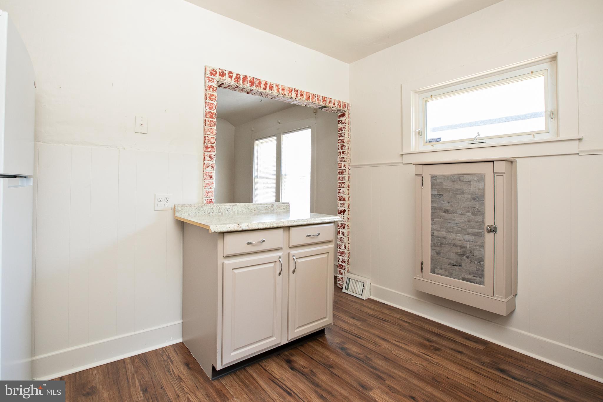 34 Valley Road Mount Ephraim, NJ 08059 - Photo 17 of 39 a bathroom with a wooden floor and a mirror