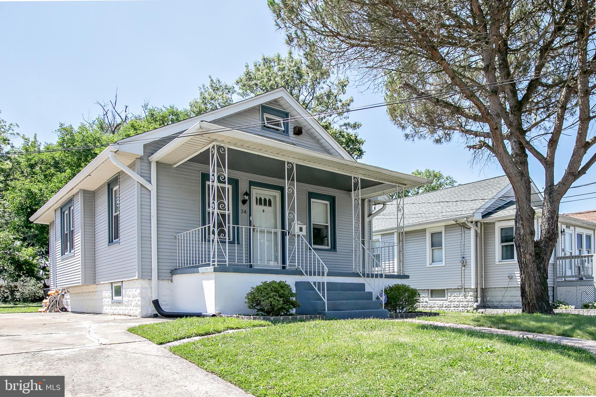 34 Valley Road Mount Ephraim, NJ 08059 - Photo 3 of 39 a front view of a house with a yard