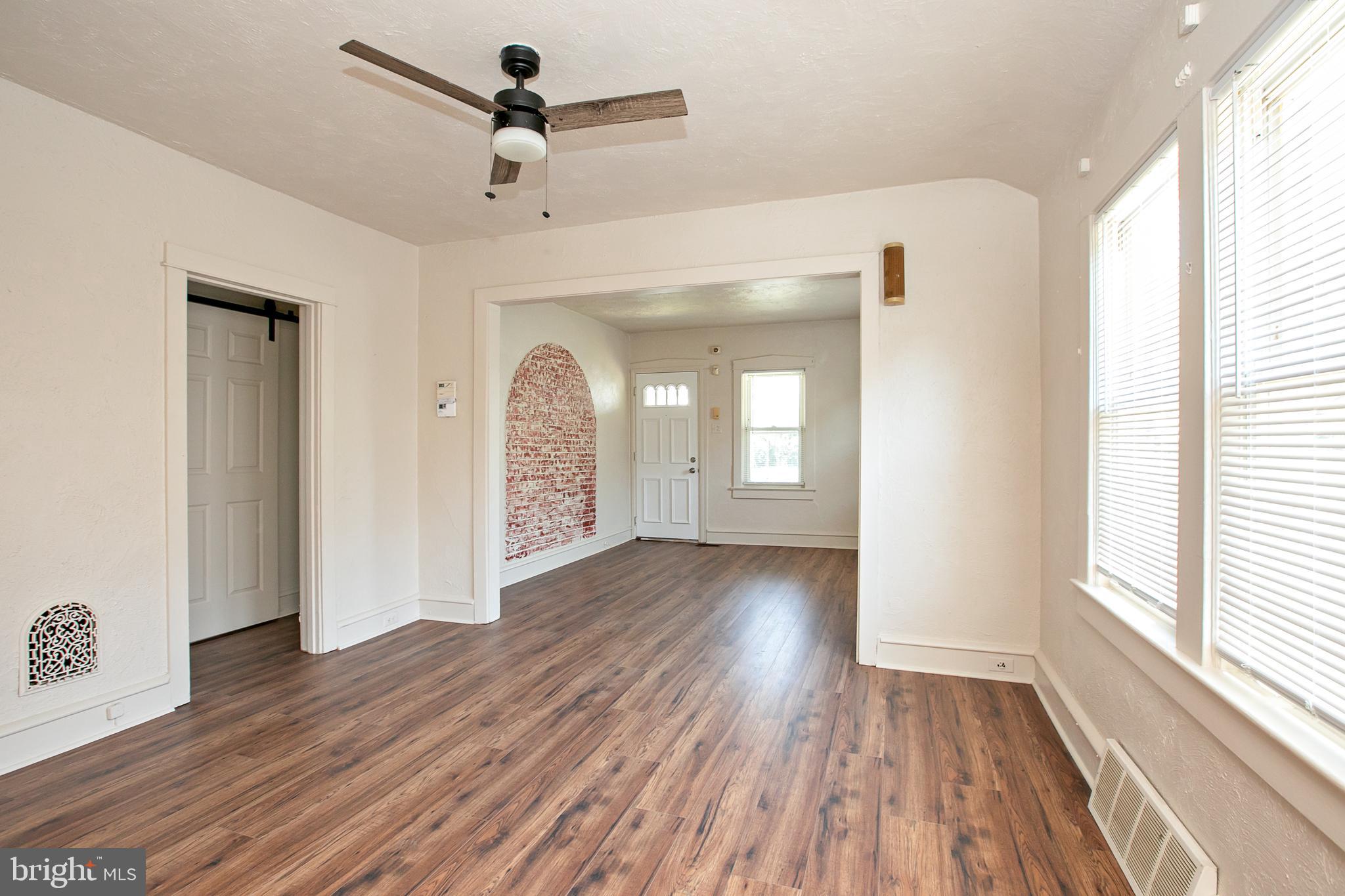 34 Valley Road Mount Ephraim, NJ 08059 - Photo 7 of 39 a view of empty room with wooden floor and fan