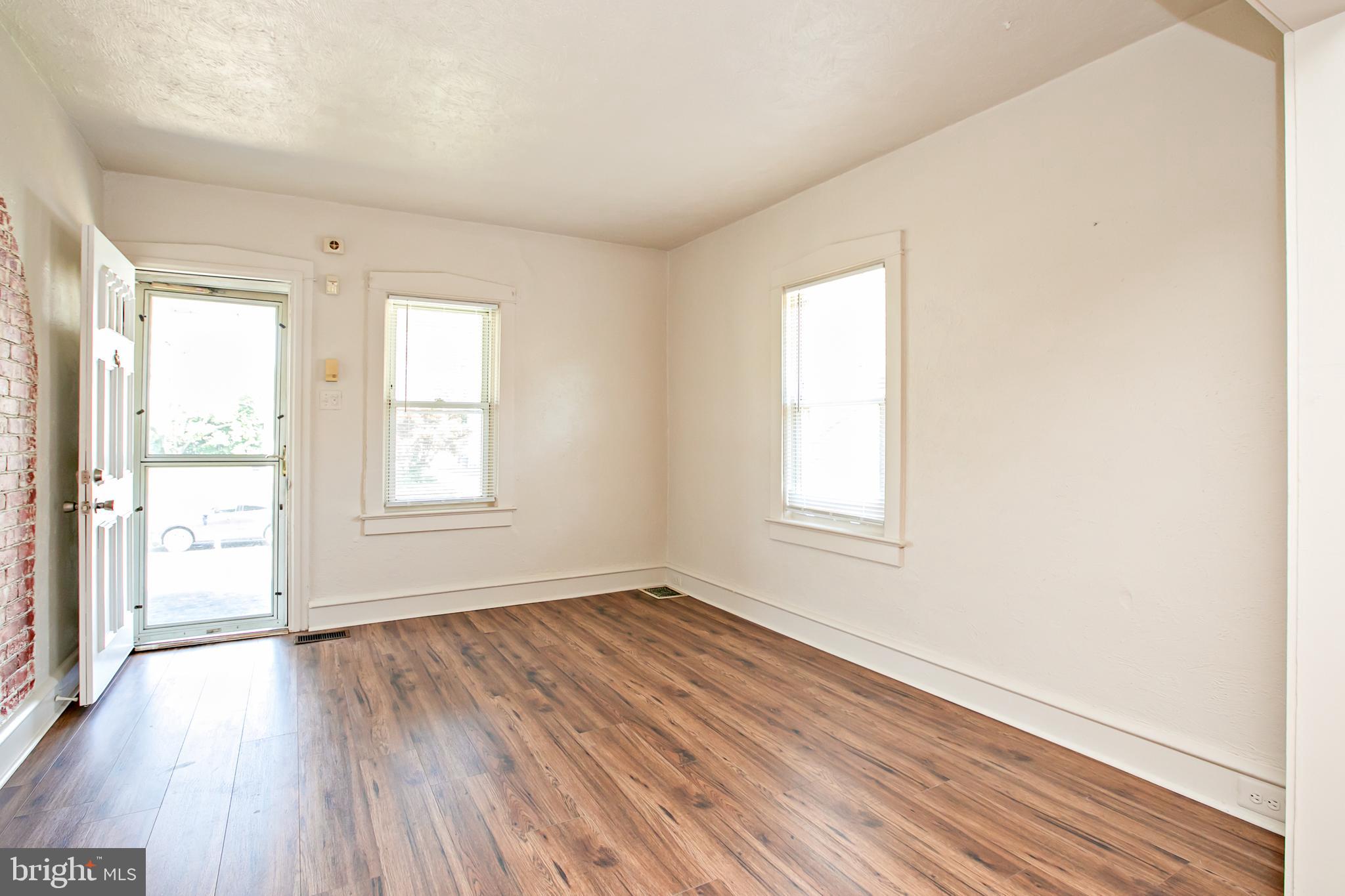 34 Valley Road Mount Ephraim, NJ 08059 - Photo 9 of 39 an empty room with wooden floor and windows