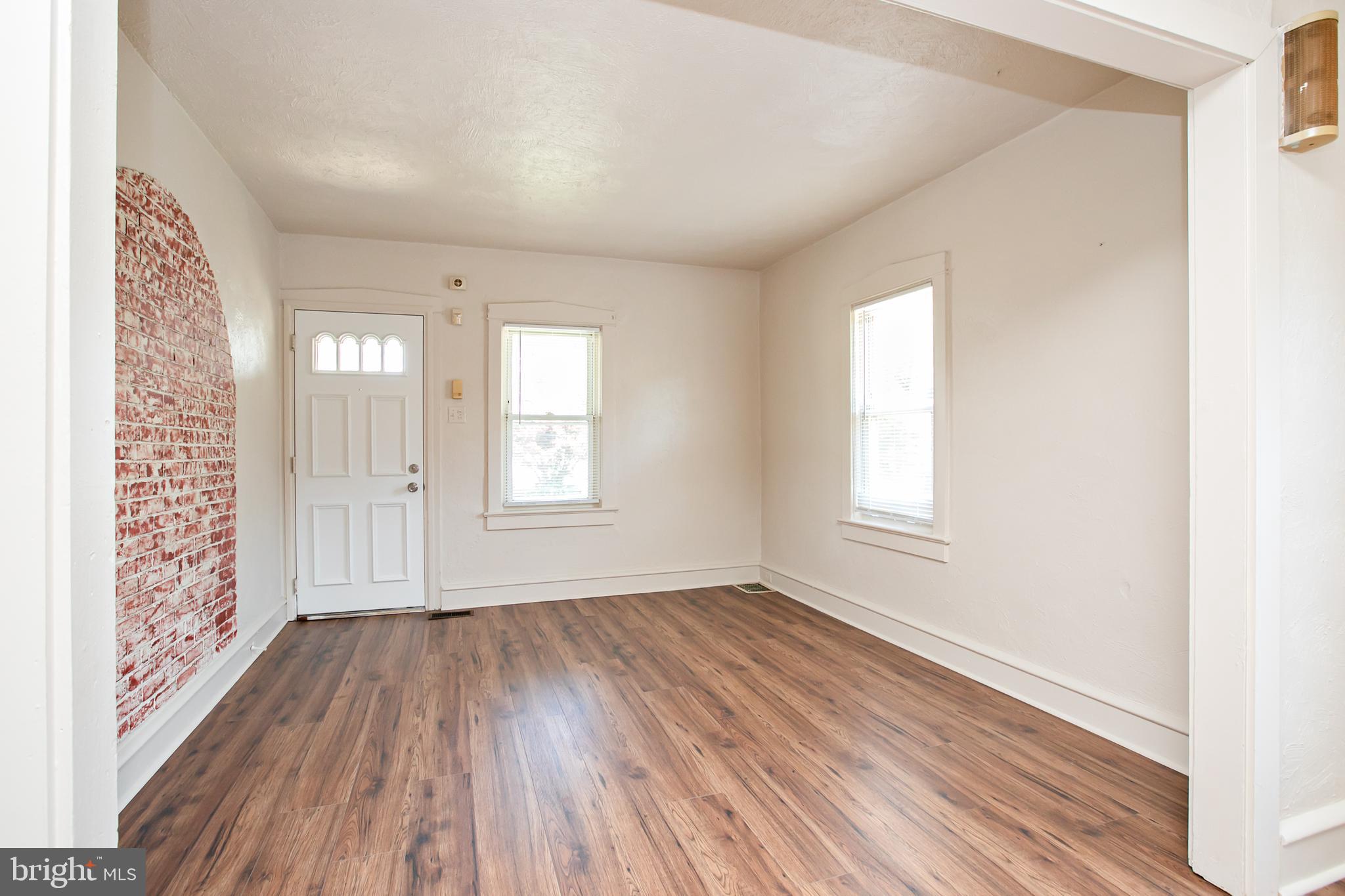 34 Valley Road Mount Ephraim, NJ 08059 - Photo 10 of 39 a view of an empty room with wooden floor and a window