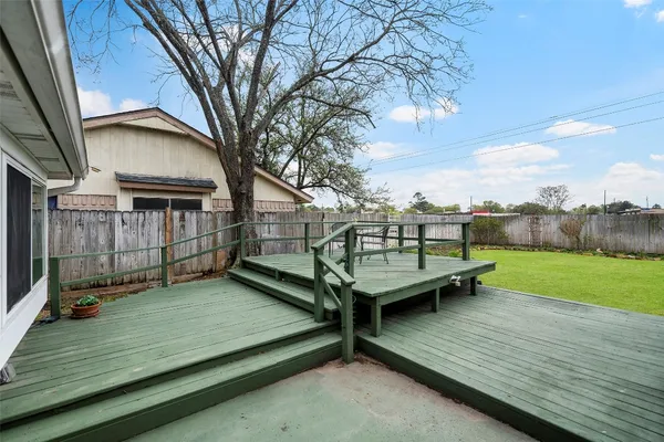 a view of a wooden deck with a bench