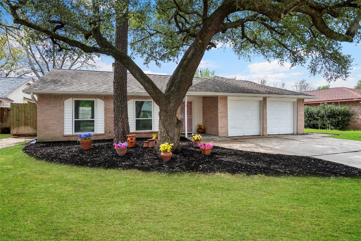 3419 Acorn Springs Lane Spring, TX 77389 - Photo 20 of 24 a front view of house with yard and outdoor seating