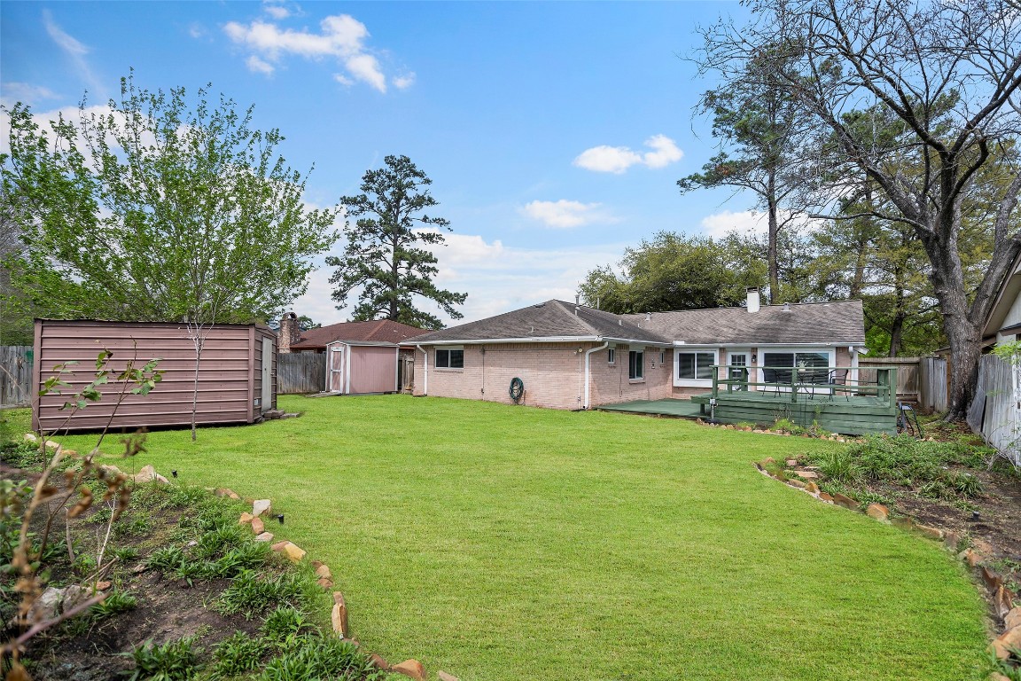 3419 Acorn Springs Lane Spring, TX 77389 - Photo 2 of 24 a view of a house with a big yard potted plants and large tree