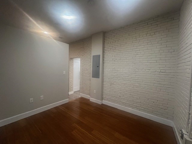 33 3rd Avenue, Unit U214 Boston, MA 02129 - Photo 13 of 17 an empty room with wooden floor and windows