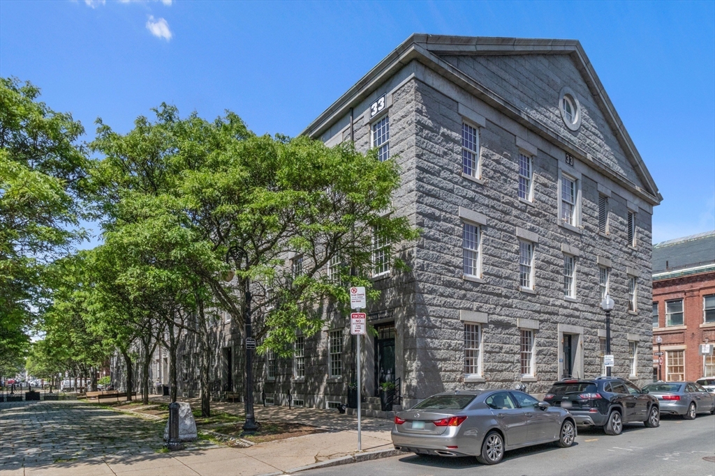 33 3rd Avenue, Unit U214 Boston, MA 02129 - Photo 2 of 17 a car parked in front of a building