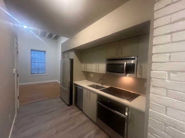 33 3rd Avenue, Unit U214 Boston, MA 02129 - Photo 6 of 17 a kitchen that has a sink and a stove top oven