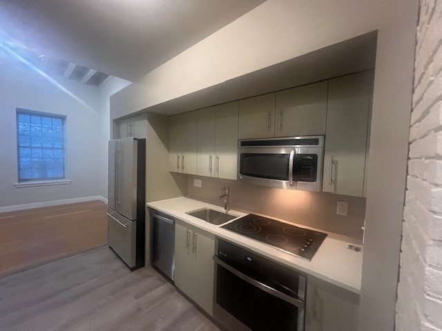 33 3rd Avenue, Unit U214 Boston, MA 02129 - Photo 7 of 17 a kitchen that has a sink and a stove top oven