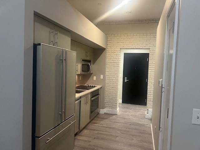 33 3rd Avenue, Unit U214 Boston, MA 02129 - Photo 8 of 17 a kitchen with stainless steel appliances granite countertop a refrigerator and a stove